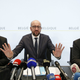 Belgium's Employment and Economy Minister Kris Peeters (L) Prime Minister Charles Michel (C) and Interior Minister Jan Jambon hold a news conference in Brussels, November 21, 2015, after security was tightened in Belgium following the fatal attacks in Paris.